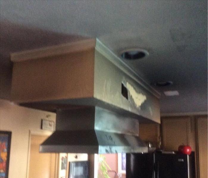 fire and soot damage kitchen ceiling and stove