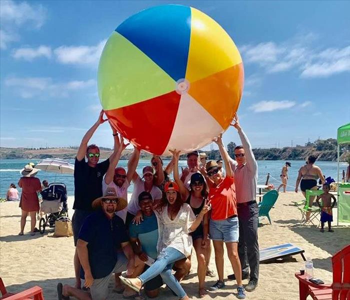 Family and friends in the industry gather at the beach for a summer party