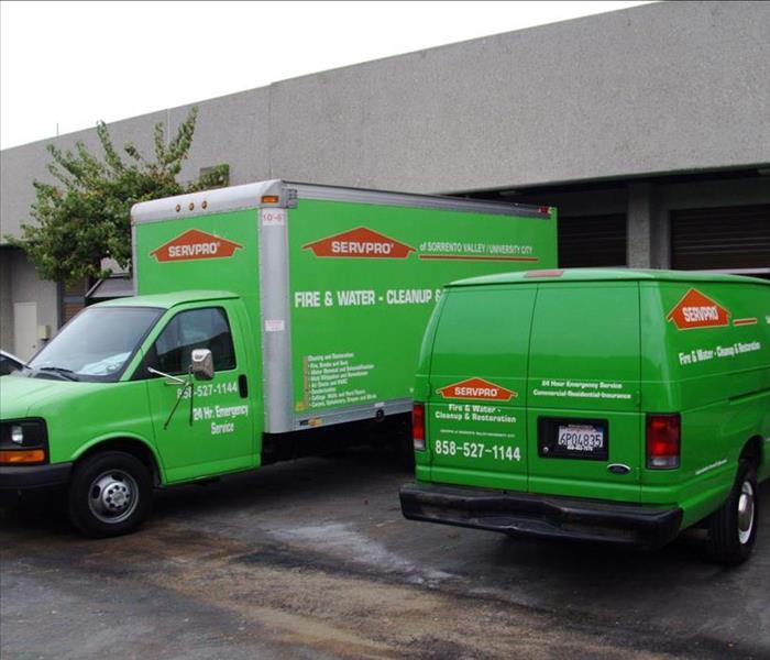 green box truck and van with servpro decals